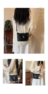 Black textured bucket bag for women with plush bear charm, shown worn crossbody style.