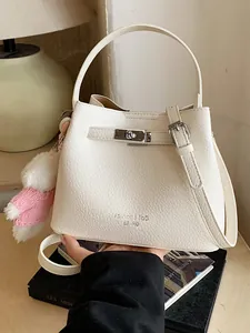 Elegant cream-white textured bucket handbag with top handle and shoulder strap for women