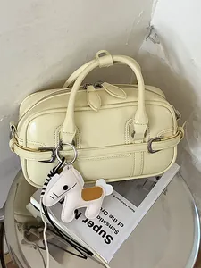 Sac à main polochon de banlieue minimaliste jaune crème avec breloque cheval mignonne