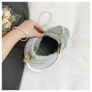Detailed view showing the interior and woven texture of the mint green conch bag