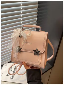 Zaino rosa estetico da donna con fibbie a stella e nastro in pizzo perlato decorativo