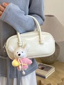Elegant white bowling handbag with cute plush puppy charm for daily commute