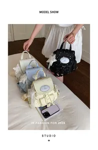 Sweet starry canvas backpacks in pastel colors shown in a professional studio setting
