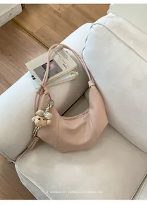 Elegant nude beige pleated hobo shoulder bag with a cute teddy bear charm for daily wear