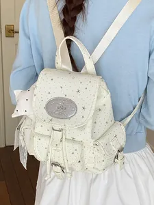 Sweet white canvas backpack with silver star patterns in a trendy school girl style.