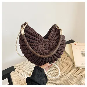Unique brown crochet seashell hobo bag with elegant pearl strap and braided handle