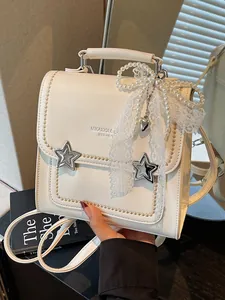 Zaino da donna crema premium con fibbie a stella e accessorio fiocco in pizzo di perle