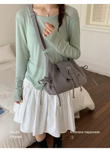 Casual grey nylon crossbody bag for women in a retro minimalist lifestyle setting
