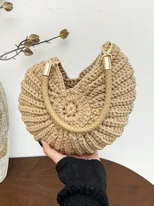 Stylish hand-woven conch shell shoulder bag with braided strap for summer leisure.