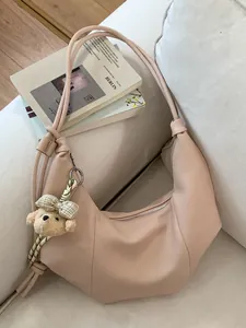 Retro pleated hobo bag for women with a cute bear charm in a soft beige minimalist style.
