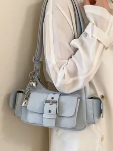 Stylish light blue underarm shoulder bag featuring multi-pockets and heart charm detail