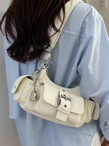 Trendy cream white underarm shoulder bag for women featuring stylish buckle and lock details