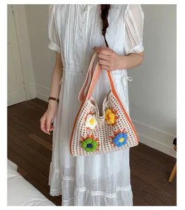 Boho style crochet tote bag with colorful 3D flower decorations for summer vacation