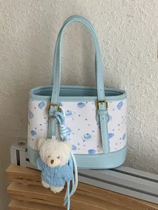 Elegant light blue and white patterned bucket bag with cute bear charm for women