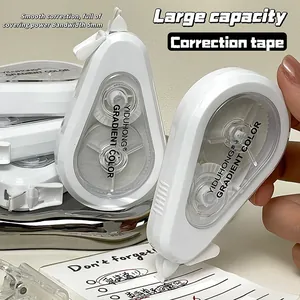 Detail of large capacity white correction tape with 5mm width used on a paper