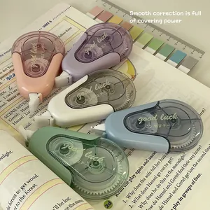 Macro view of multi-colored correction tapes with Good Luck printed on the casing