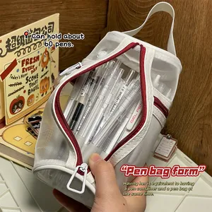 Vue détaillée de la trousse en maille blanche de grande capacité remplie de stylos gel