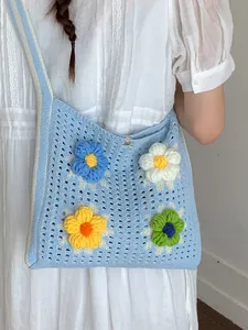 Casual blue crochet knit shoulder bag with colorful knit flower patches for women