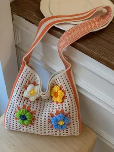 Casual knit tote bag with vibrant 3D floral decorations for bohemian beach holidays