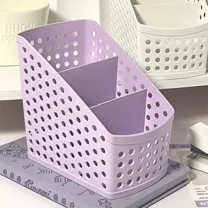 Close-up of purple 3-tier desk organizer with hollow grid design for stationery storage