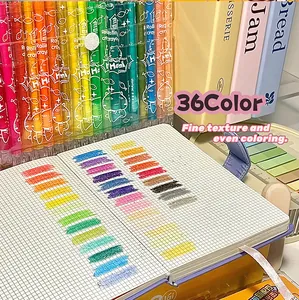 36-color rotating crayon set for kids art, featuring smooth texture on grid paper.