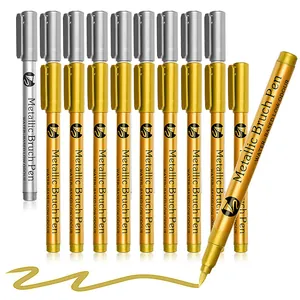 Detail view of gold and silver metallic brush pens showing the soft felt tip and ink