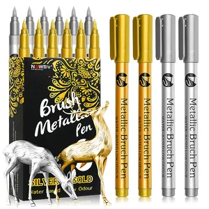 Detailed view of gold and silver metallic brush pens with premium black and gold box
