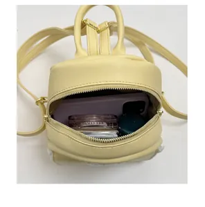Internal capacity view of a cute yellow mini backpack for women