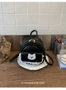 Cute black women's backpack with cartoon bear patch and delicate lace trim detail