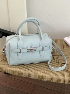 Elegant light blue lychee grain leather bowling bag with stylish silver hardware buckle