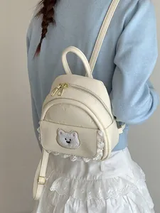 Fashionable cream mini backpack for women with cute bear embroidery and lace trim