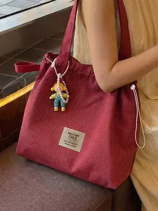Large capacity red checkered canvas tote bag for women featuring a cute decorative doll charm