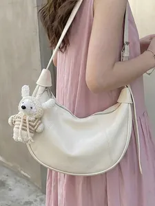 Fashionable cream dumpling crossbody bag with cute knitted charm for women