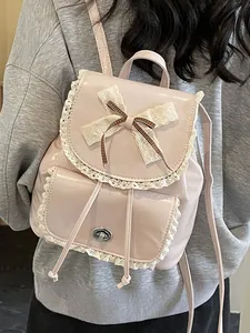 Pink lolita style backpack with lace trim and bowknot detail
