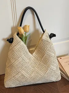 Sac fourre-tout de plage en paille tressé à la main avec anses à nœuds noires chic