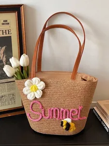 Handcrafted straw beach bag with 3D Summer embroidery and flower charm