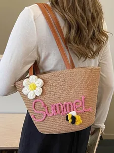 Handmade woven straw beach bag featuring Summer rope embroidery and cute floral accents