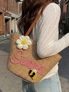 Woven straw beach tote bag with 'Summer' embroidery and decorative crochet flower
