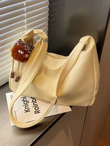 Creamy yellow large capacity tote bag for women with cute plush charm