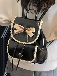 Elegant black glossy PU leather backpack featuring sweet white lace trim and bow knot for women
