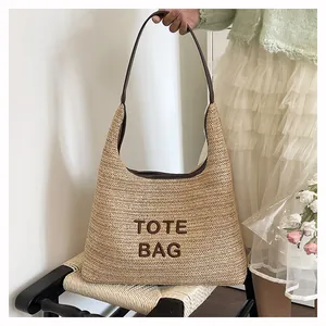 Close-up of a handmade woven tote bag with 'TOTE BAG' lettering placed on a black chair