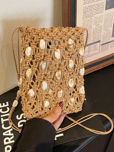 Bolso de hombro de paja macramé hecho a mano con cuentas de mármol para la playa.