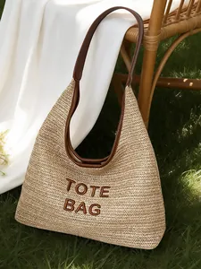 Handmade woven straw tote bag with brown leather strap and TOTE BAG embroidery