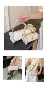 Lifestyle view of cream polka dot barrel bags in two sizes with cute bear patches
