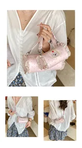 Detailed view of mini pink polka dot bag with ruffles and cute bear patch design