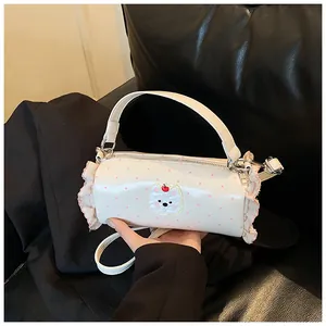 Cute mini white barrel handbag featuring pink polka dots, ruffle edges and animal patch