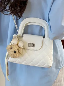 Elegant white quilted chain handbag for women featuring a cute teddy bear charm detail