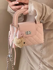 Elegant pink quilted handbag with chain strap and cute teddy bear charm decoration