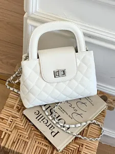 Elegant white quilted leather handbag featuring a silver chain strap and top handle design