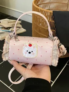Mini pink cylindrical handbag with cute cartoon bear applique and stylish polka dots